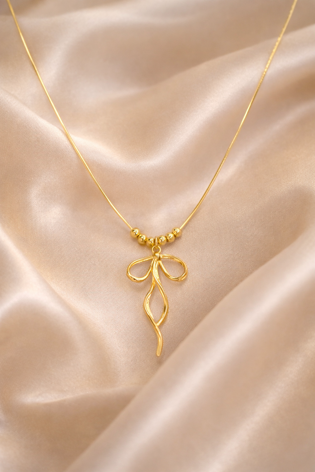 Cutie bow necklace gold